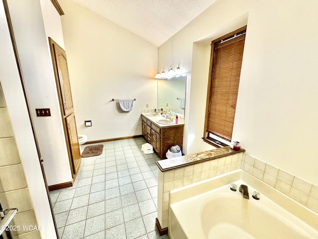 2969 Sands Rd, Lima, OH 45805 - bathroom with vanity, a bath, toilet, tile patterned floors, and a textured ceiling