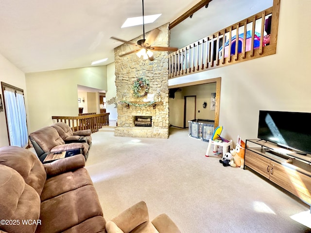 2969 Sands Rd, Lima, OH 45805 - living area with lofted ceiling, carpet flooring, a ceiling fan, a skylight, and a stone fireplace