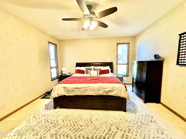 2969 Sands Rd, Lima, OH 45805 - bedroom featuring carpet floors, baseboards, wallpapered walls, a textured ceiling, and ceiling fan