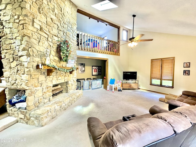 2969 Sands Rd, Lima, OH 45805 - living area with carpet floors, a fireplace, ceiling fan, a skylight, and high vaulted ceiling