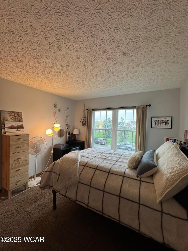 bedroom featuring carpet flooring and a textured ceiling