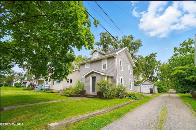 219 W O Connor Ave, Lima, OH 45801 - american foursquare style home featuring a garage, an outbuilding, a front yard, and driveway
