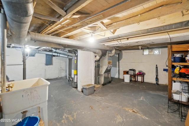 219 W O Connor Ave, Lima, OH 45801 - below grade area with gas water heater, a sink, heating unit, and electric panel