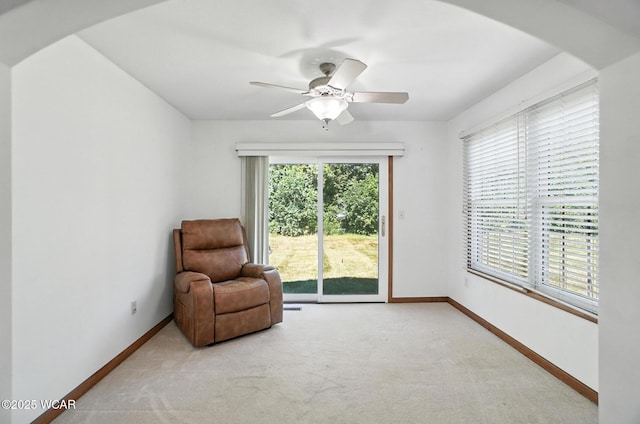 556 Westerly Dr, Lima, OH 45805 - sitting room with carpet flooring, arched walkways, and a ceiling fan