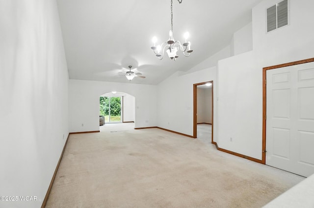 556 Westerly Dr, Lima, OH 45805 - unfurnished living room featuring vaulted ceiling, a chandelier, arched walkways, light colored carpet, and a ceiling fan