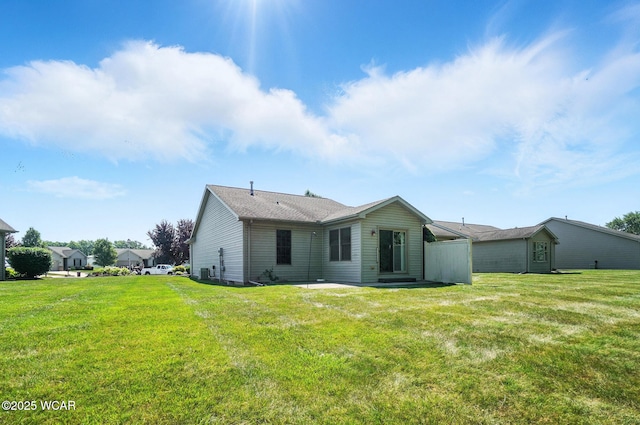 556 Westerly Dr, Lima, OH 45805 - back of property with a lawn and a patio