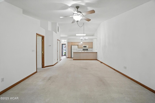 556 Westerly Dr, Lima, OH 45805 - unfurnished living room featuring ceiling fan, light colored carpet, a chandelier, and lofted ceiling