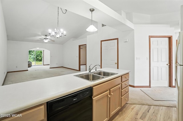 556 Westerly Dr, Lima, OH 45805 - kitchen with black dishwasher, vaulted ceiling, pendant lighting, light countertops, and light carpet