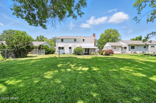 1851 Wendell Ave, Lima, OH 45805 - rear view of property with a chimney