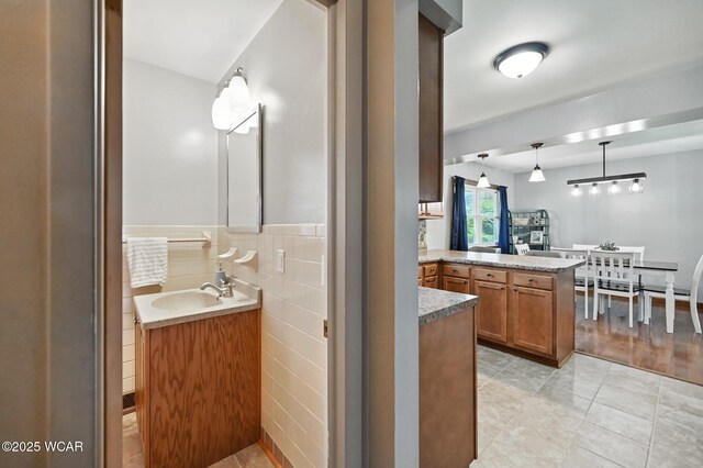 1851 Wendell Ave, Lima, OH 45805 - full bath featuring vanity, tile patterned flooring, and tile walls