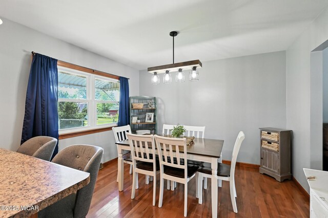 1851 Wendell Ave, Lima, OH 45805 - dining area with hardwood / wood-style flooring and baseboards