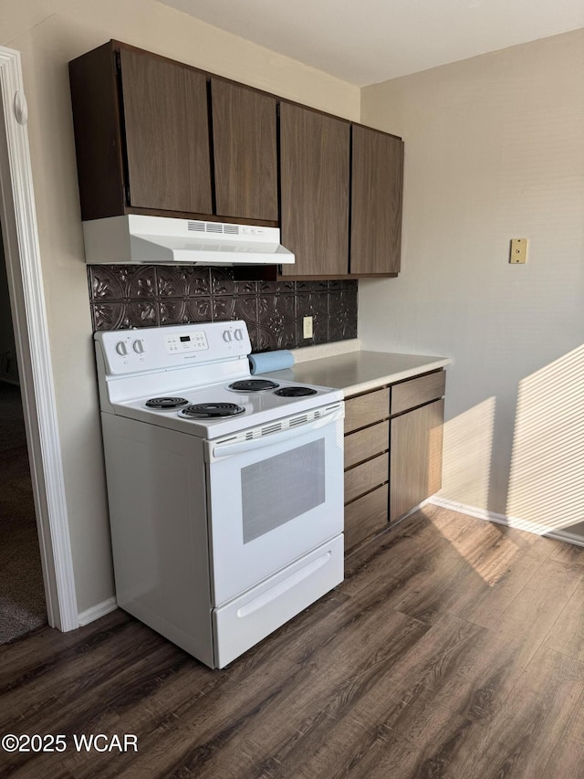 2275 N Cable Rd Unit 25, Lima, OH 45807 - kitchen featuring white electric range, under cabinet range hood, dark wood finished floors, light countertops, and dark brown cabinetry