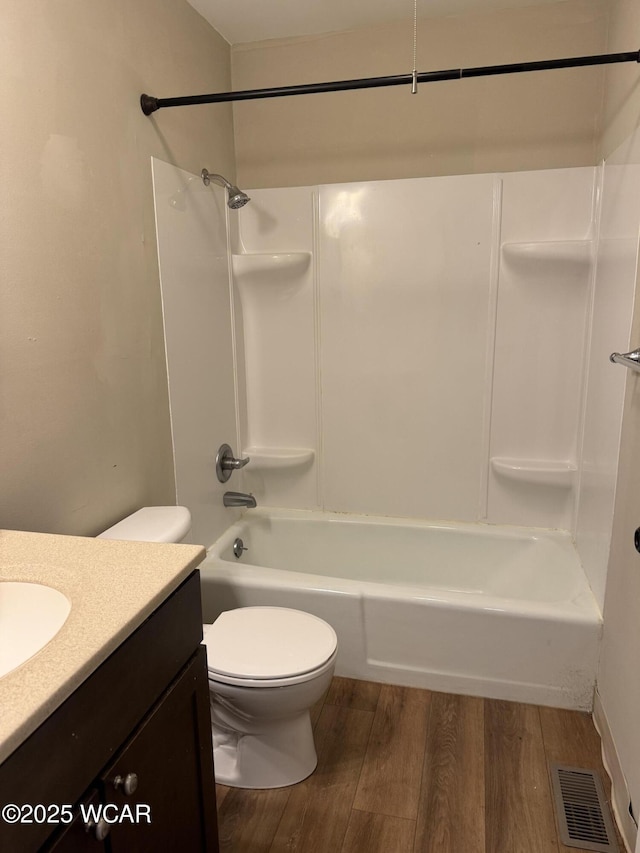 2275 N Cable Rd Unit 25, Lima, OH 45807 - bathroom featuring wood finished floors, vanity, and shower / tub combination