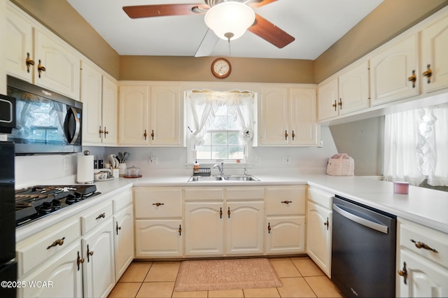 kitchen with dishwasher, a sink, ceiling fan, black gas cooktop, and light tile patterned flooring