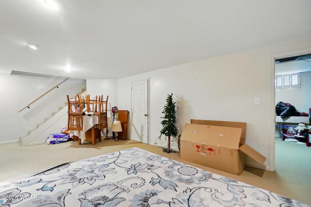 basement with carpet floors and stairs