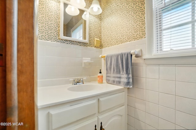 bathroom with tile walls and vanity