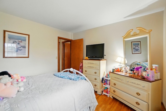 bedroom with light wood-type flooring