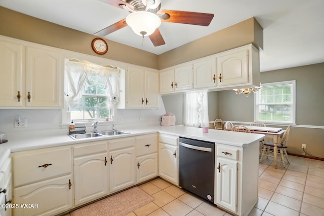 kitchen with dishwasher, a sink, a peninsula, ceiling fan, and light tile patterned floors