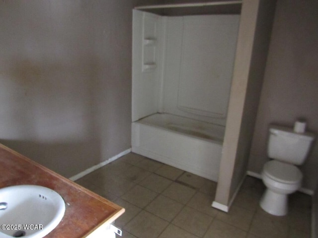 full bathroom featuring tile patterned floors, vanity, toilet, and bathing tub / shower combination