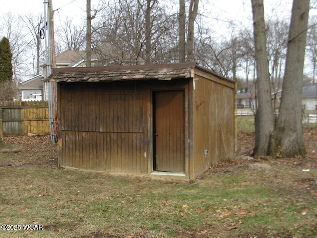 view of outbuilding featuring a lawn