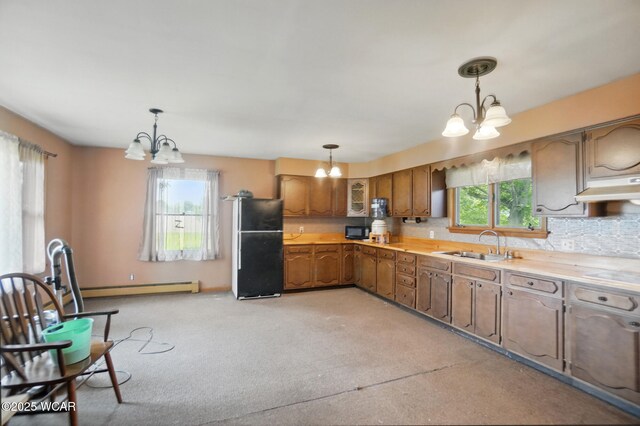 411 W Pattison Ave, Kenton, OH 43326 - kitchen featuring a chandelier, black appliances, a sink, and baseboard heating