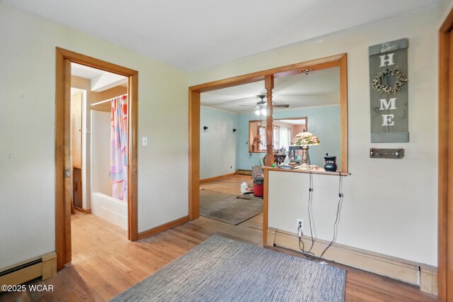 411 W Pattison Ave, Kenton, OH 43326 - corridor featuring baseboard heating, light wood-style floors, and baseboards