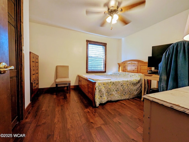 bedroom featuring a ceiling fan and dark wood-style flooring