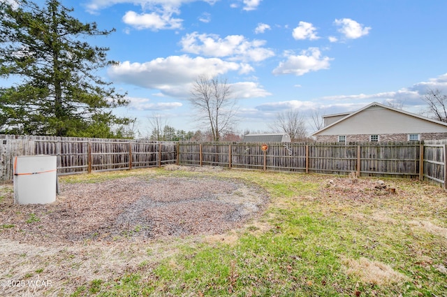 view of yard with a fenced backyard