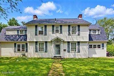 402 S Woodlawn Ave, Lima, OH 45805 - colonial house with a chimney and a front lawn