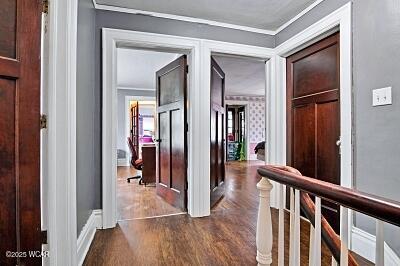 402 S Woodlawn Ave, Lima, OH 45805 - hall featuring dark wood-type flooring and crown molding