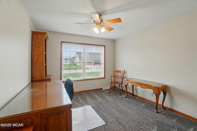 1330 Christina St, Delphos, OH 45833 - home office with a ceiling fan, dark carpet, and baseboards