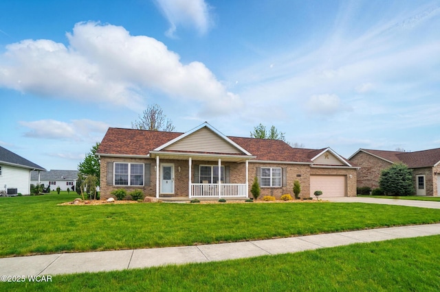 1330 Christina St, Delphos, OH 45833 - view of front of property with a porch, a front lawn, concrete driveway, and brick siding