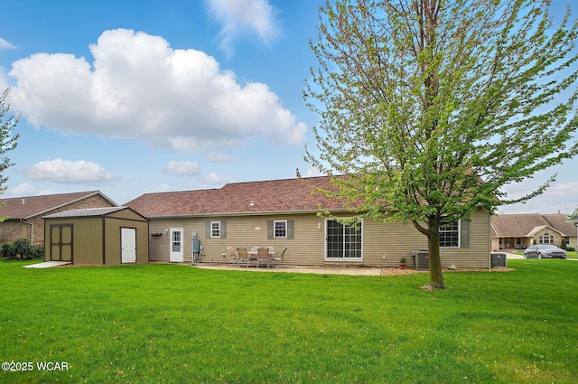 1330 Christina St, Delphos, OH 45833 - rear view of house featuring a storage unit, a patio, a lawn, and central air condition unit