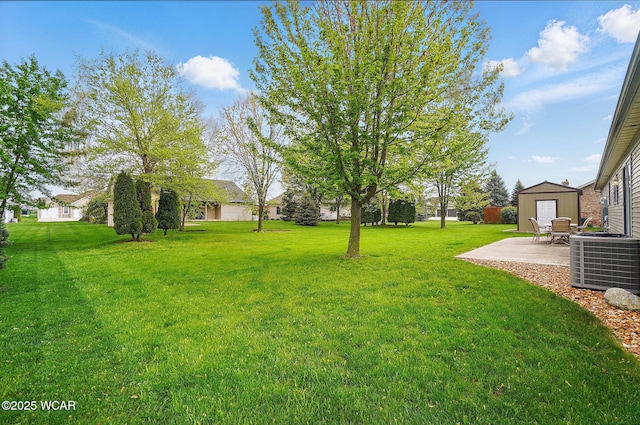 1330 Christina St, Delphos, OH 45833 - view of green lawn with central air condition unit and a patio area