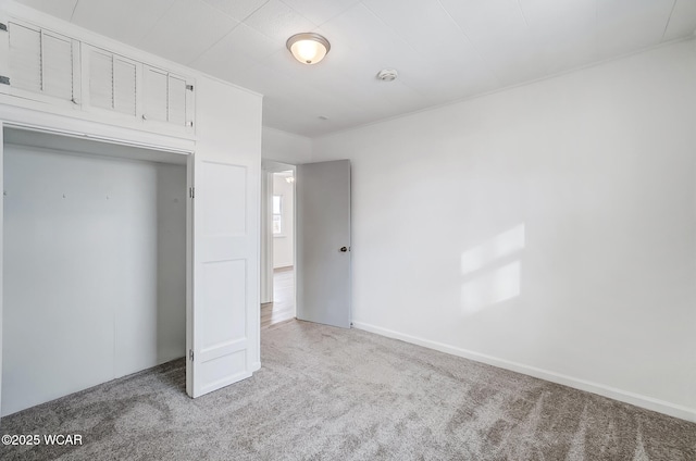 unfurnished bedroom with light carpet