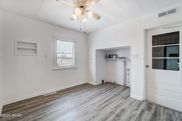 unfurnished room featuring light hardwood / wood-style floors and ceiling fan