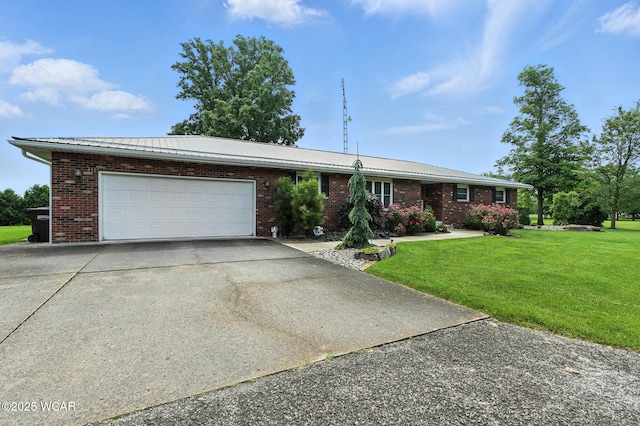 10815 Holdgreve Rd, Delphos, OH 45833 - ranch-style home with brick siding, concrete driveway, a front lawn, an attached garage, and a metal roof
