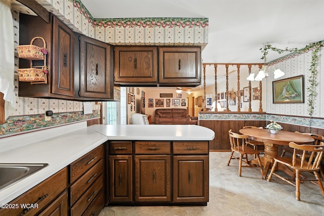10815 Holdgreve Rd, Delphos, OH 45833 - kitchen featuring wallpapered walls, a peninsula, and light countertops
