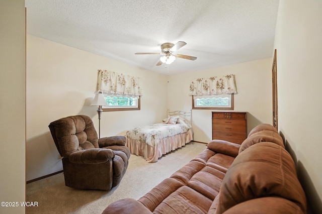 10815 Holdgreve Rd, Delphos, OH 45833 - bedroom with light colored carpet, multiple windows, a textured ceiling, and ceiling fan