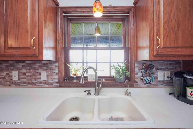 14351 Rd 19, Fort Jennings, OH 45844 - kitchen featuring a sink, brown cabinets, and decorative backsplash