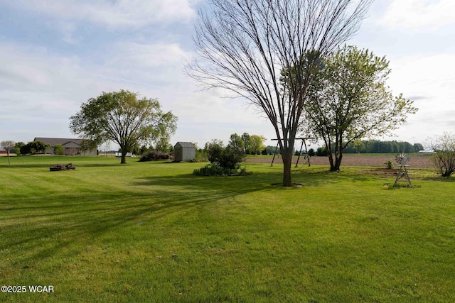 14351 Rd 19, Fort Jennings, OH 45844 - view of green lawn featuring a shed and an outdoor structure