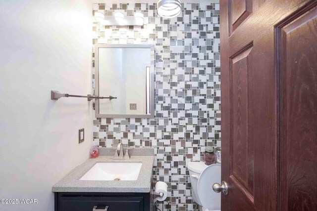 14351 Rd 19, Fort Jennings, OH 45844 - clothes washing area featuring dark wood finished floors, independent washer and dryer, cabinet space, and baseboards