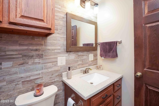 14351 Rd 19, Fort Jennings, OH 45844 - bathroom with toilet, vanity, backsplash, and tile walls
