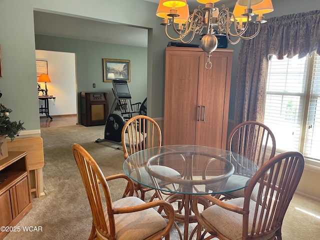 3031 Yoakam Rd, Lima, OH 45806 - dining room with light carpet and a chandelier