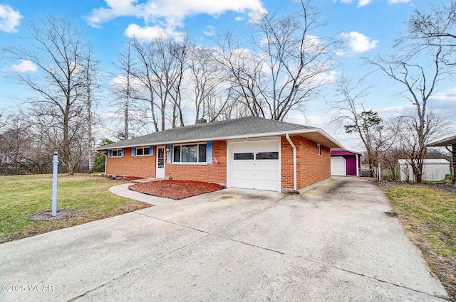 single story home featuring a garage, a chimney, roof with shingles, a front yard, and brick siding