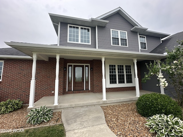 1640 Olt Rd, Columbus Grove, OH 45830 - entrance to property featuring covered porch and brick siding