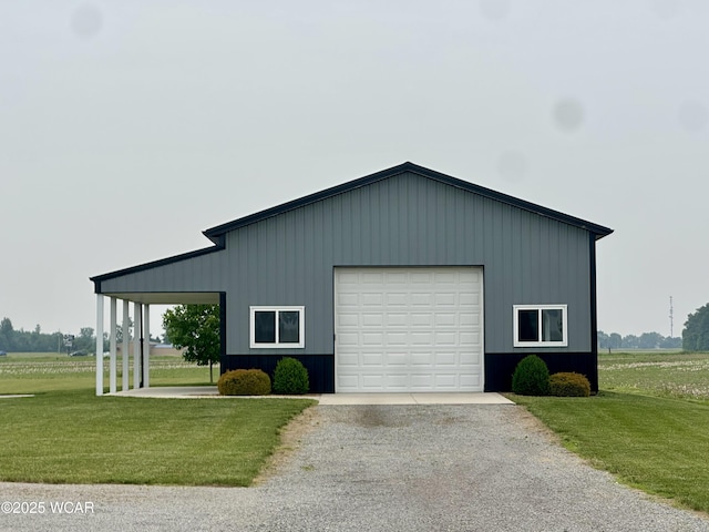 1640 Olt Rd, Columbus Grove, OH 45830 - view of front of house featuring an outbuilding, a front yard, driveway, and a detached garage
