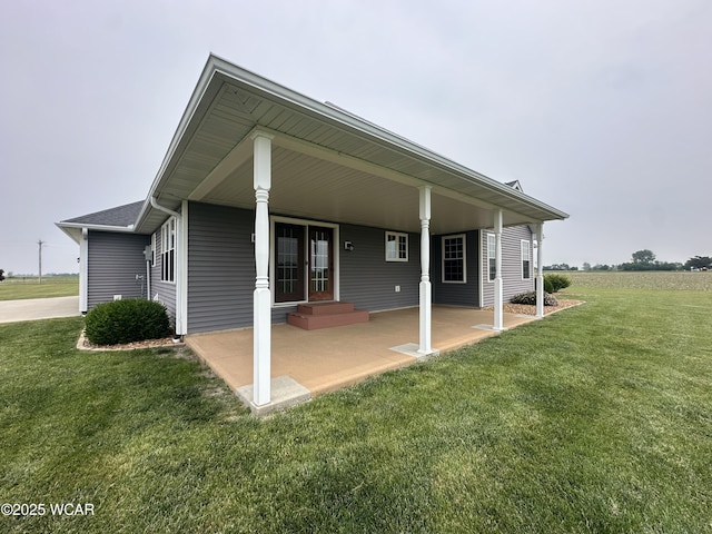 1640 Olt Rd, Columbus Grove, OH 45830 - rear view of property with a lawn and a patio