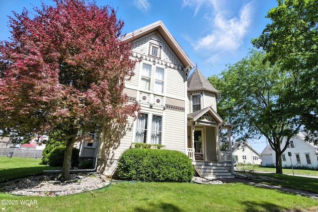 302 N Market St, Van Wert, OH 45891 - victorian house featuring a front lawn and covered porch