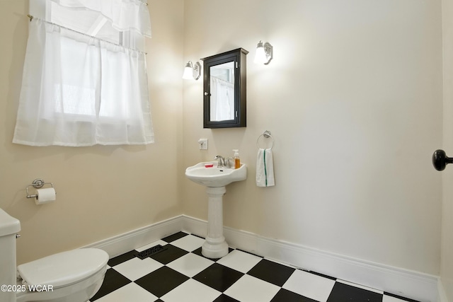 302 N Market St, Van Wert, OH 45891 - half bathroom featuring tile patterned floors and toilet